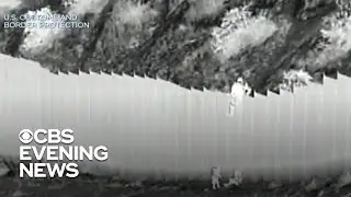 Video shows smugglers dropping young kids over border barrier