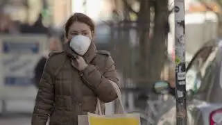 Woman wearing face mask and coat walking on street  4K | No Copyright / Free Stock Footage