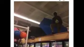 Guy jumps into ball pit