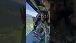 Jumpmaster Sends Paratroopers out of Helicopter