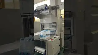 PET bottle beverage mineral water shrink packaging machine #packagingmachine  #shrinkwrap #factory