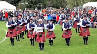 Pipe Bands march before Chieftain as they arrive at the 2025 Pitlochry Highland Games in Scotland
