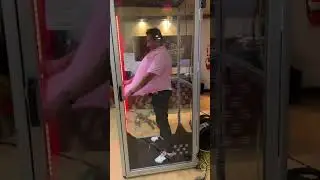 Inside the glass cabin full of money
