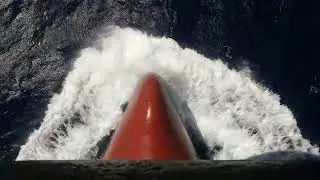 Ship's bulbus bow cutting on sea...