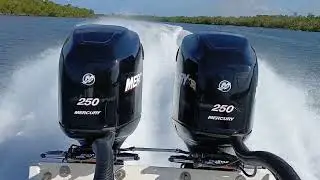 26 scarab spirit with twin mercury optimax 250s getting on plane.