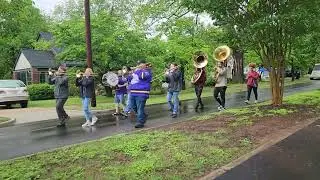 Bone Yard of Brass kick-off Porchfest 2025 by marching in the Saints.