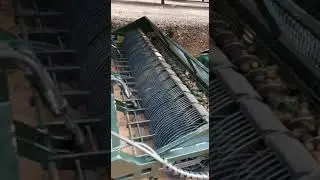 Macadamia Nut harvester picking ip complete nut with husk from ground-- From Ritlee