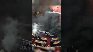 Serbian opposition lawmakers protest government with smoke grenades and tear gas