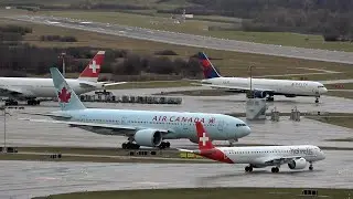 Airplanes at strong westwind and rain at Zurich airport ZRH