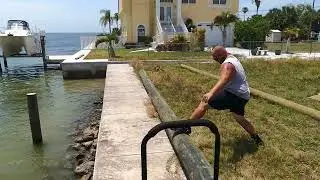 Dock Installation 3 - Rolling the Piling into the Water