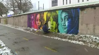 This artist braved the cold to paint a mural in Denver
