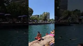 Zurich people relaxing on a hot day at Letten
