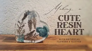 Making a cute resin heart with artificial flowers and glitter