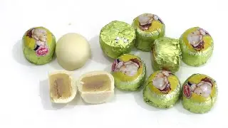 Chocolates out of white Chocolate (35%) with nougat-core (9%) and marzipan filling (56%) with lemon.