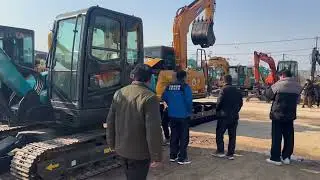 Customer conducts on site inspection of Sunward Intelligent SWE80E used excavators