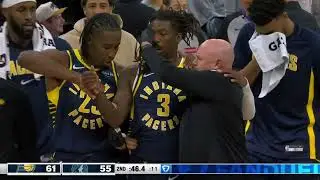 Delon Wright is bleeding from his head and taken out of the game after a head collision with Clark