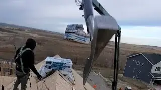 loading a steep roof  9/12 pitch #subscribe #construction #roofing #contractor  #like