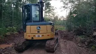 Building a logging road with a John Deer excavator and moving a hunting stand