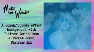 A bokeh/bubble effect background with Distress Oxide inks and Picket Fence Distress Ink