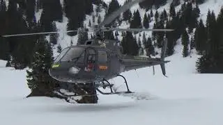 Airbus Helicopters Eurocopter AS350 B2 Ecureuil F-GKBE landing on skiing slope in Avoriaz french Alp