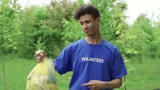 A Volunteer Holding a Plastic Garbage Trash - Keep India Clean & Green l Adopt Any Public Areas
