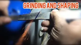Knife making. Grinding line with table stone. Sanding.