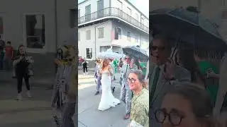 Wedding secondline rolling down Bourbon Street