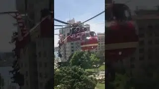 Helicopter lifting a steel beam. April 29,2023.