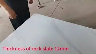 This dining table is made of slate，carbon steel and marble slab.