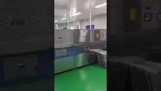 Microwave heating tunnel furnace for reheating and sterilization of food products