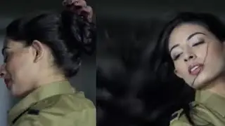 Beautiful Policewoman opens her hair twice. Policewoman drops her hair bun. She let her hair down