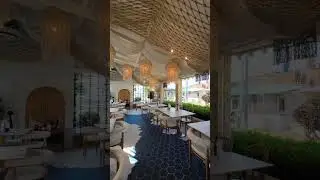 Bright and airy cafe restaurant interior with large windows