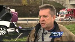 Coal truck overturns onto pickup truck, dumps load of coal