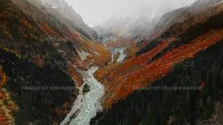 Survey of vibrant river corridor with quick currents and rugged shores during autumn season