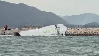 Cargo aircraft skids off Hong Kong runway, collides with security patrol car, killing 2, AP explains