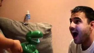 got tickled while scaring daddy with his dinosaur