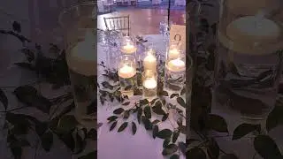 Candle and greenery wedding centerpiece