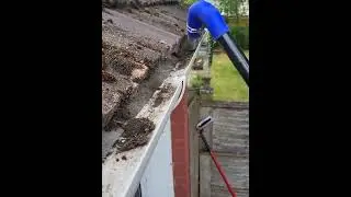Wizard Wash gutter vacuuming