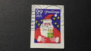 Postage stamp. USA. Greetings. Santa Claus with a gift. Price 29 cents.