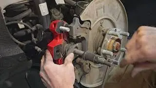 How to compress the rear caliper on a Tesla Model 3 Performance.