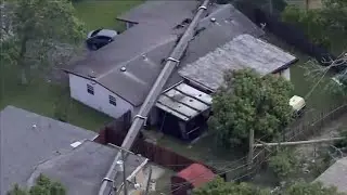 Workers clear away last pieces of toppled crane