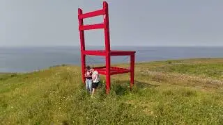 Big Red Chair with people for scale.