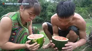 Survival Skills - Find Fish by a bow - Primitive Life Cooking Fish in Watermelon - Eating Delicious