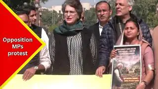 Opposition MPs protest against the government at the Makar Dwar of the Parliament...