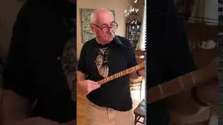 Jim Reda playing the strum stick the crafted.