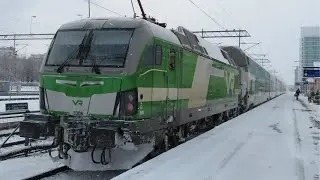 Finland: Oulu, a VR class Sr3 electric loco leaves on an InterCity train from Rovaniemi to Helsinki