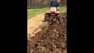 Amf 1040 tractor plowing garden