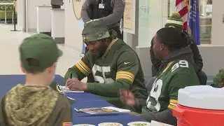 Packers players surprise hospital patients and staff with holiday visit