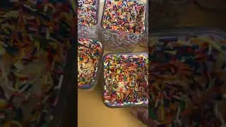 Adding sprinkles to my birthday candle jars