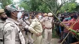 Officer from Hailakandi Police engaging in a dialogue with the protesters